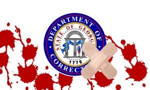 bandaids over blood on ga corrections logo for commissioner ward