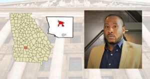 Commission Chair Joshua Deriso pictured next to map of Cordele and Crisp County